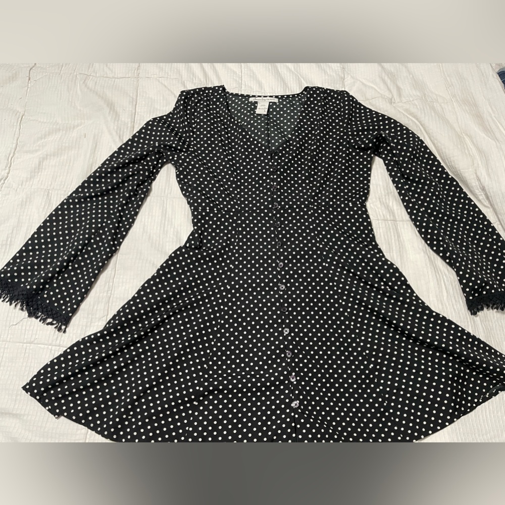 Poka dot dress with bell cuffs